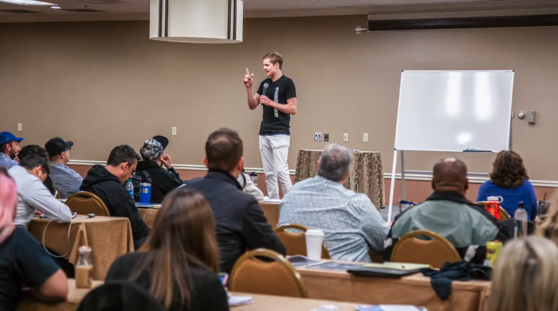 Josh Forti speaking to a room of entrepreneurs