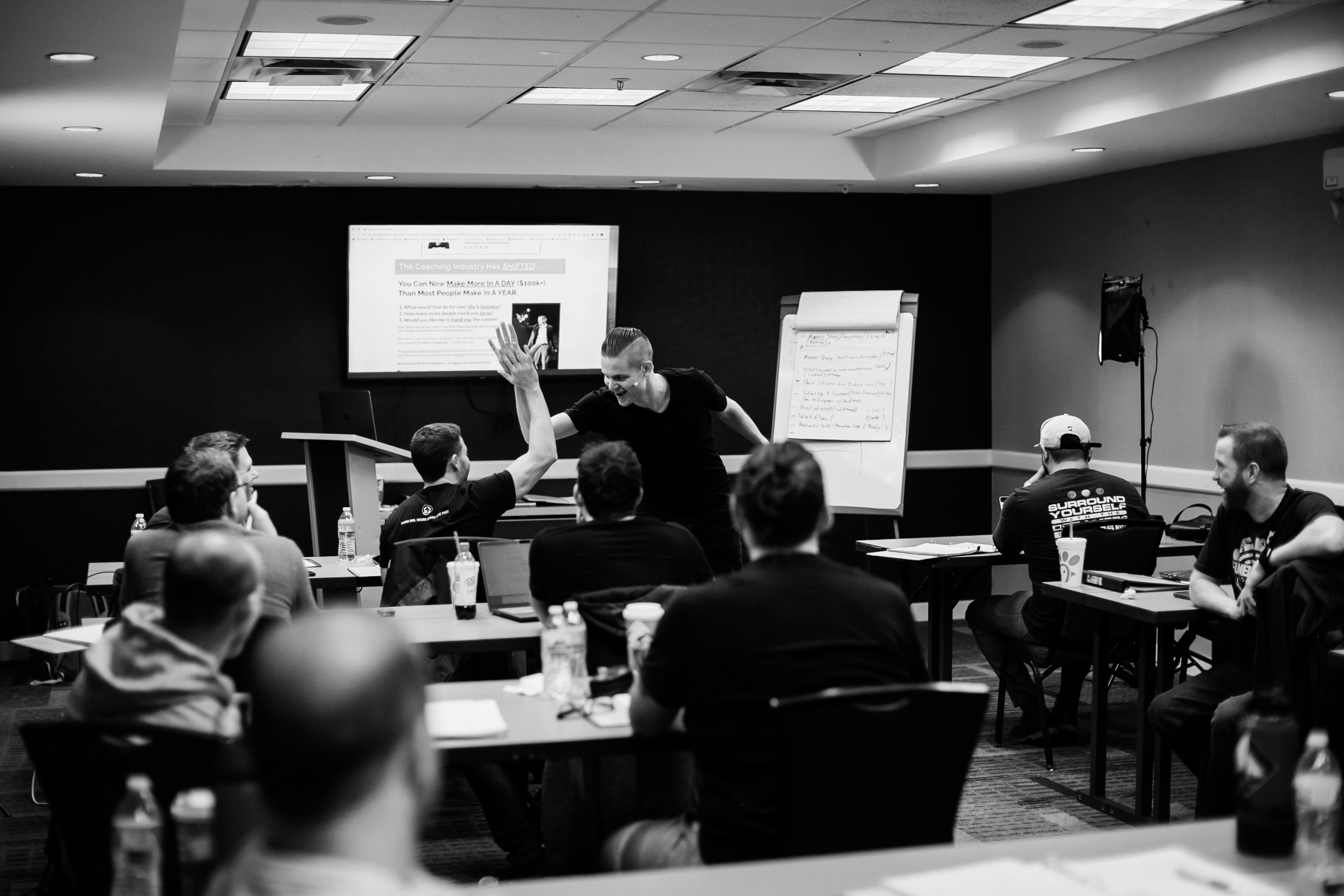 Josh Forti high-fiving an attendee at a live event